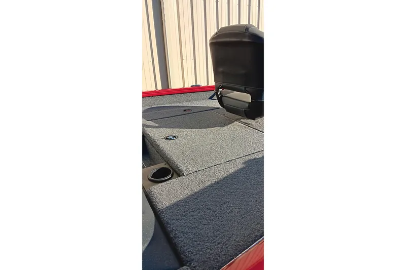 Slide: The Image of 2025 Tracker Pro Team 175 boat interior with carpeted deck and seating. - 5
