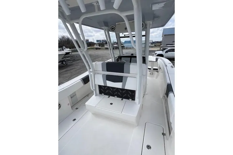 Slide: The Image of 2026 Robalo R270 Center Console boat interior with seating and console view. - 17