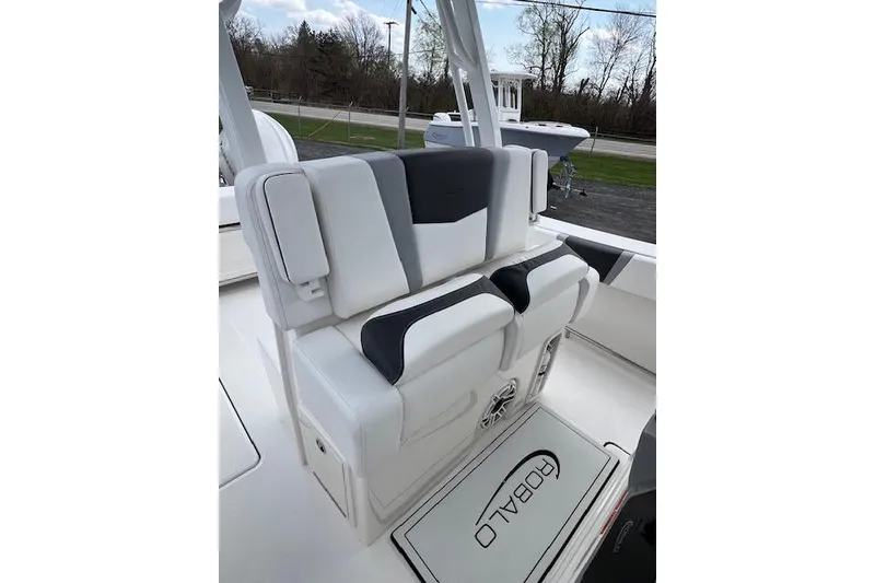Slide: The Image of 2026 Robalo R270 Center Console boat with sleek white seating and modern design. - 22