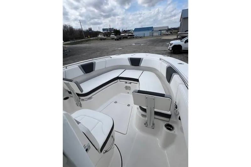 Slide: The Image of 2026 Robalo R270 Center Console boat with spacious seating and sleek design. - 24