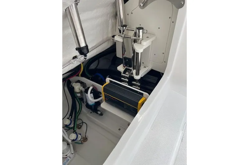 Slide: The Image of 2026 Robalo R270 Center Console boat interior, showcasing mechanical components and wiring. - 34
