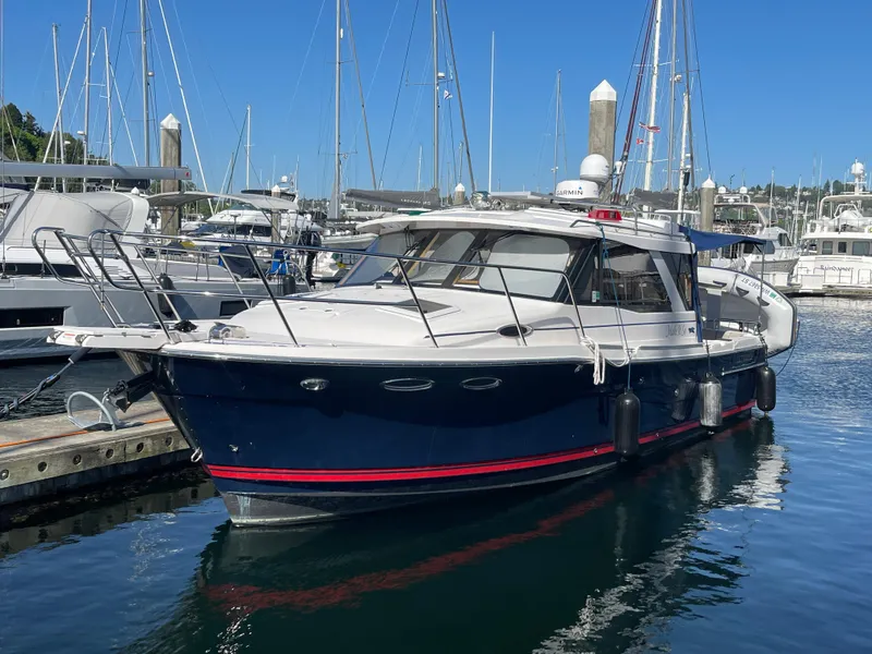 The Image of 2019 Cutwater C-30 Sedan boat docked in marina. - 0