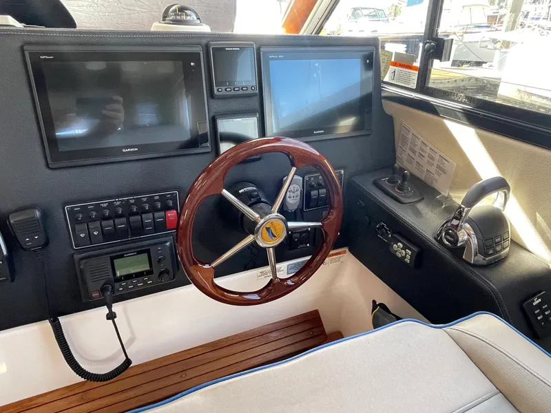 Slide: The Image of Interior view of 2019 Cutwater C-30 Sedan cockpit with modern navigation. - 13