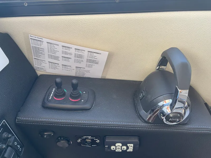 Slide: The Image of 2019 Cutwater C-30 Sedan boat controls and dashboard. - 14