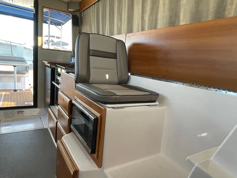 Slide: The Image of Interior of 2019 Cutwater C-30 Sedan with seat and microwave. - 17