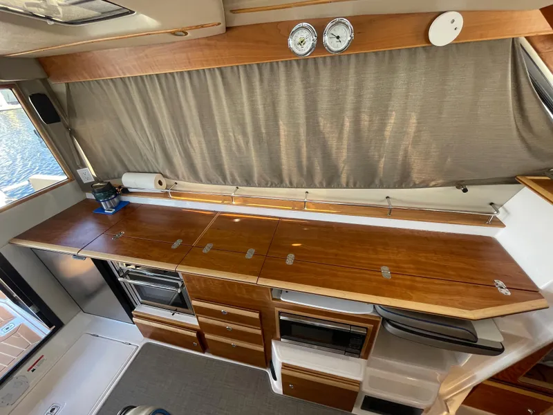 Slide: The Image of Interior of 2019 Cutwater C-30 Sedan with wooden cabinetry. - 20