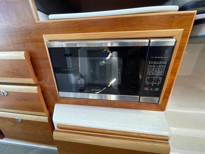 Slide: The Image of Microwave in the kitchen of a 2019 Cutwater C-30 Sedan. - 23