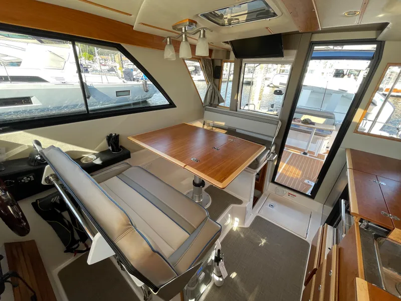 Slide: The Image of Interior of 2019 Cutwater C-30 Sedan boat with seating and table. - 27