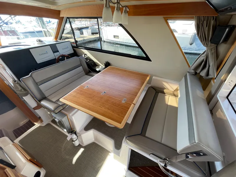 Slide: The Image of Interior of 2019 Cutwater C-30 Sedan with dining table and seating area. - 28