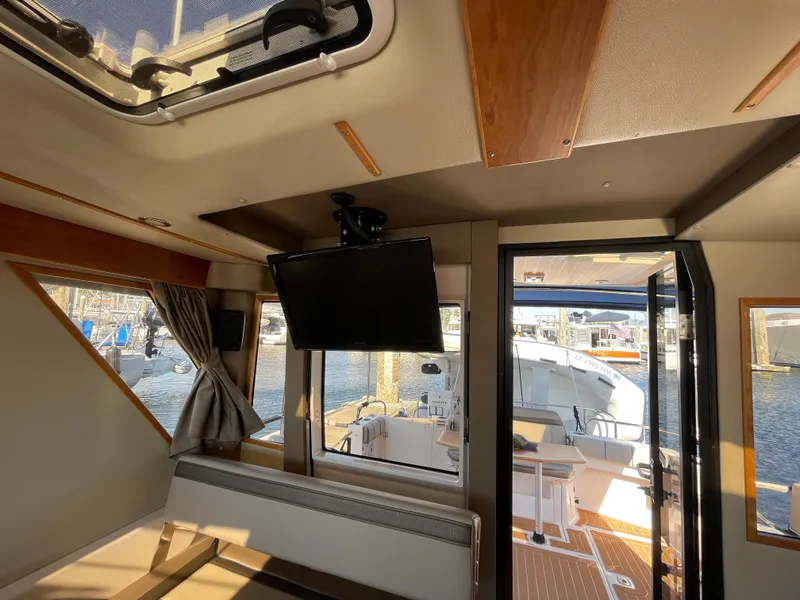 Slide: The Image of Interior of 2019 Cutwater C-30 Sedan boat with TV and seating. - 29
