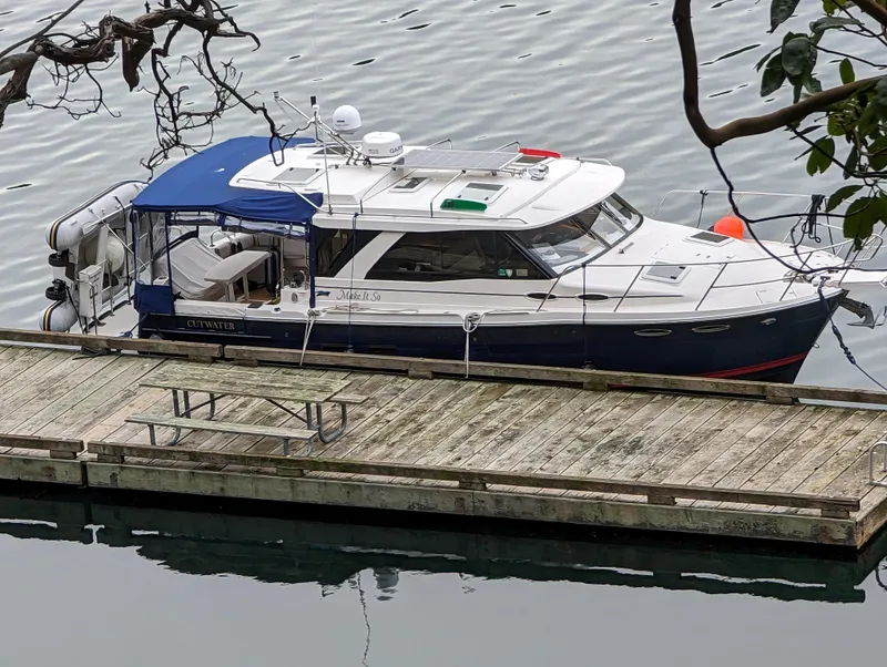 Slide: The Image of 2019 Cutwater C-30 Sedan docked, calm waters. - 3