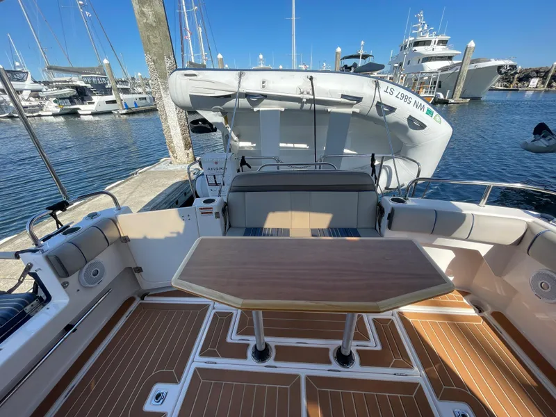 Slide: The Image of 2019 Cutwater C-30 Sedan boat interior with wooden table. - 39