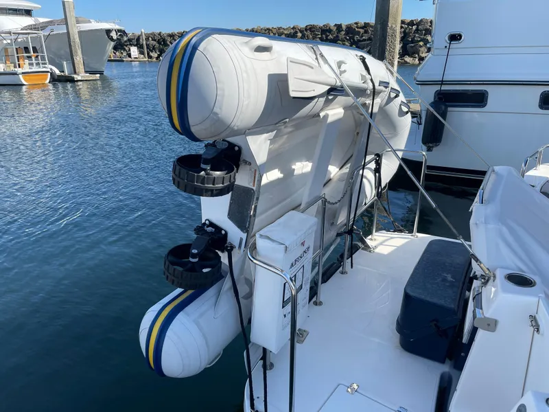 Slide: The Image of 2019 Cutwater C-30 Sedan with dinghy attached at the stern. - 47