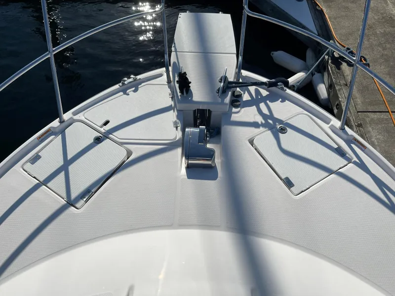 Slide: The Image of Deck of a 2019 Cutwater C-30 Sedan boat by the water. - 48