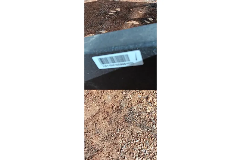 Slide: The Image of Barcode on 2024 Tracker Pro Team 175 TXW boat, outdoor setting. - 21