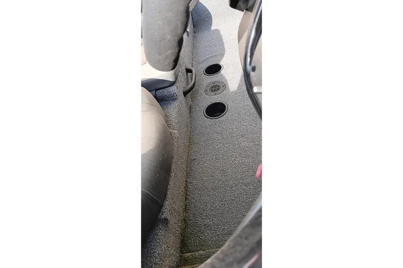 Slide: The Image of 2024 Tracker Pro Team 175 TXW interior with carpeted flooring and cup holders. - 6