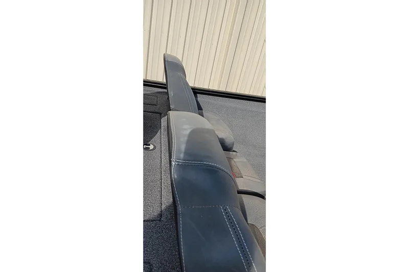 Slide: The Image of 2024 Tracker Pro Team 175 TXW boat seats with gray upholstery and stitching detail. - 7