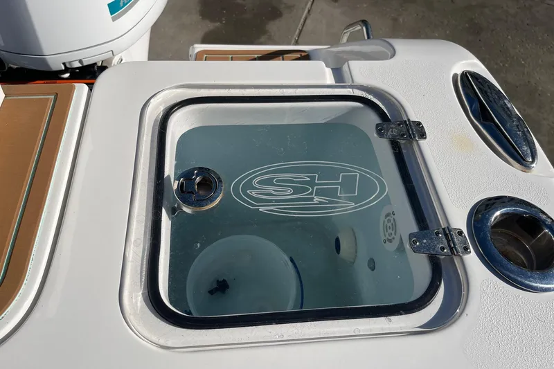 Slide: The Image of 2021 Sea Hunt Gamefish 27 Coffin Box with glass lid and logo detail. - 12