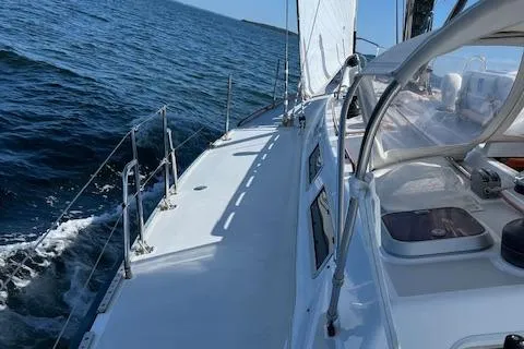 Slide: The Image of Sailing on a 1989 J Boats J/44 yacht, gliding through open waters. - 11