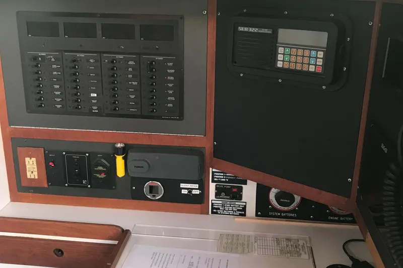 Slide: The Image of Electrical control panel on a 1989 J Boats J/44 yacht, featuring switches and navigation equipment. - 17