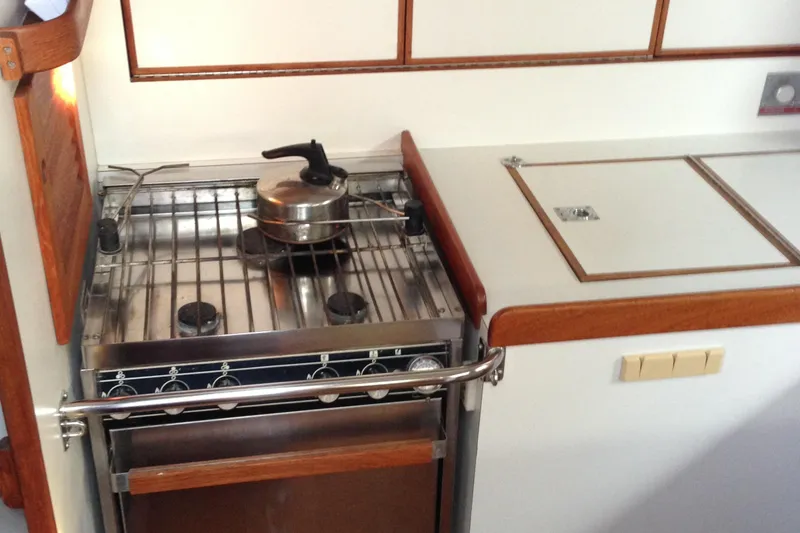 Slide: The Image of Galley kitchen in 1989 J Boats J/44 yacht with stove and pot. - 22
