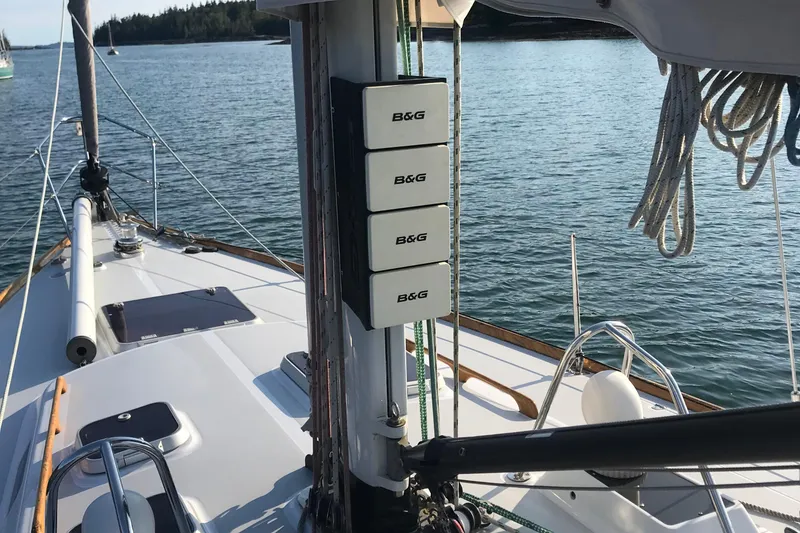 Slide: The Image of 1989 J Boats J/44 sailboat deck with B&G instruments, moored on calm water. - 7