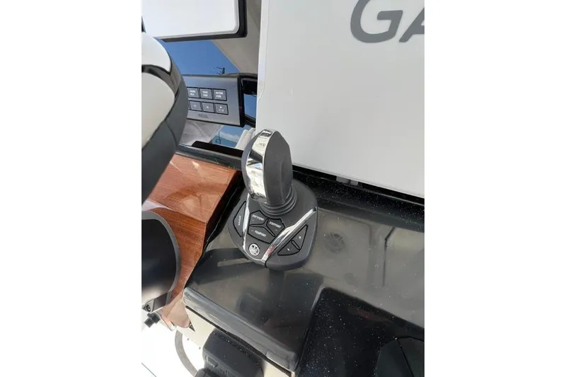 Slide: The Image of Joystick control on 2026 Robalo R300 Center Console boat dashboard. - 15
