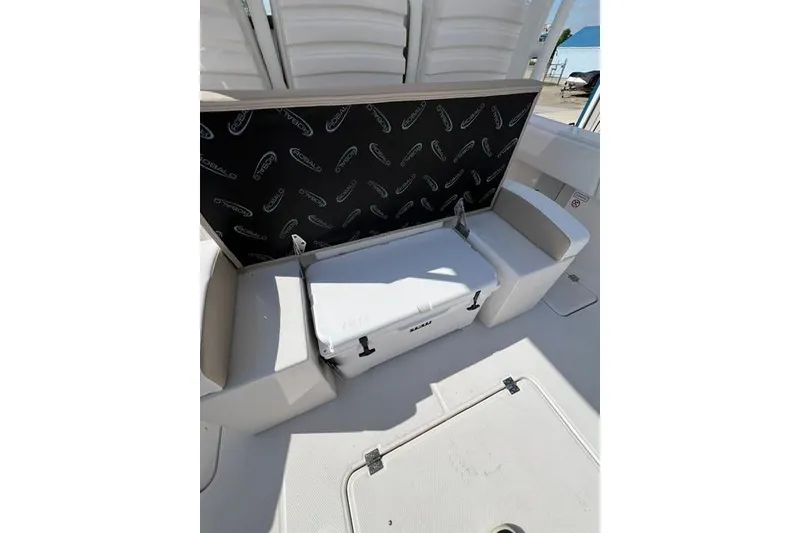 Slide: The Image of 2026 Robalo R300 Center Console boat interior with storage compartment open. - 18
