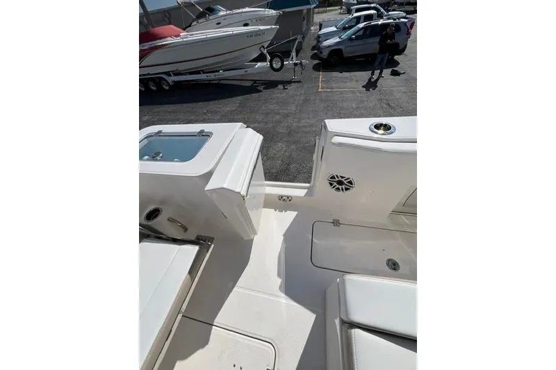 Slide: The Image of 2026 Robalo R300 Center Console boat interior with seating and storage compartments. - 20