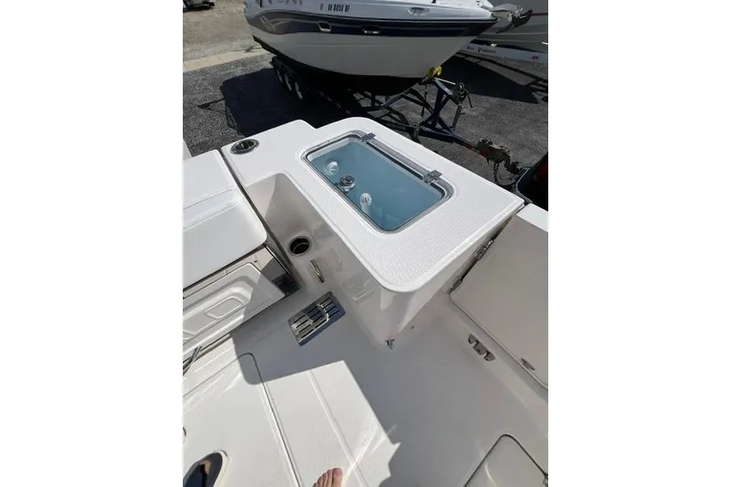 Slide: The Image of 2026 Robalo R300 Center Console boat interior with livewell and seating. - 22