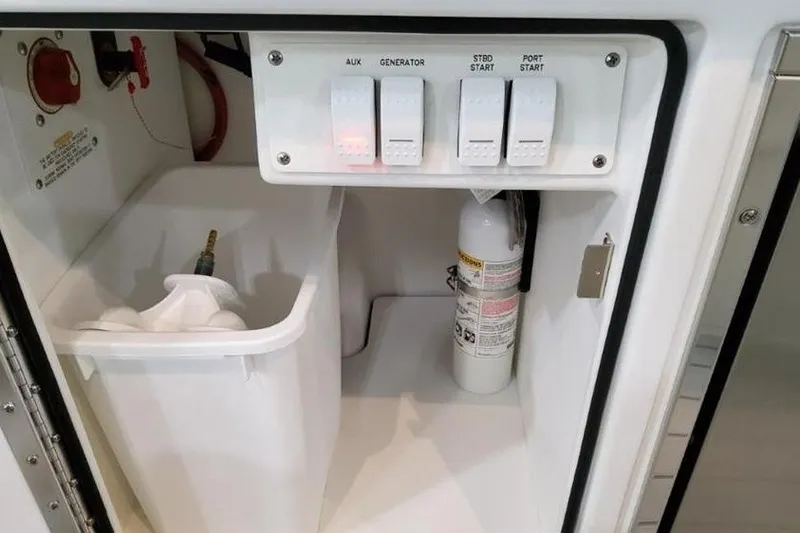 Slide: The Image of Control panel and storage compartment in 2026 Formula 360 Crossover Bowrider I/O boat. - 12