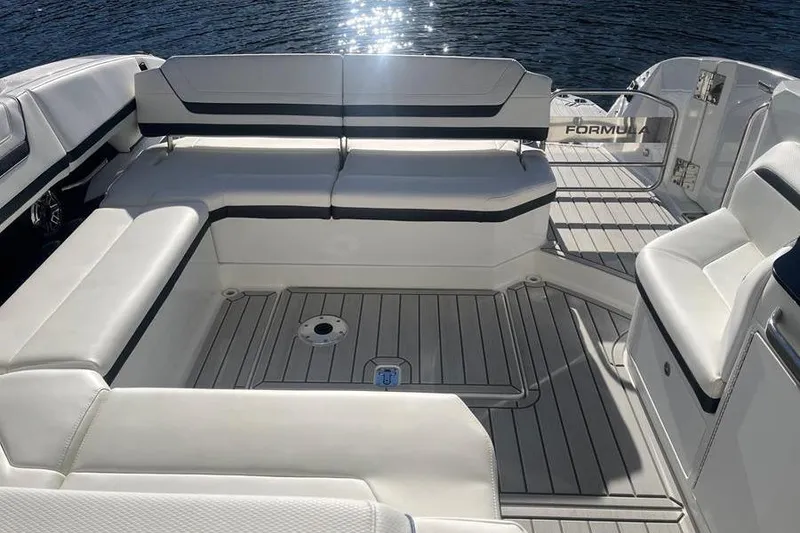 Slide: The Image of Luxurious seating on 2026 Formula 360 Crossover Bowrider I/O, with sleek design and waterfront view. - 16