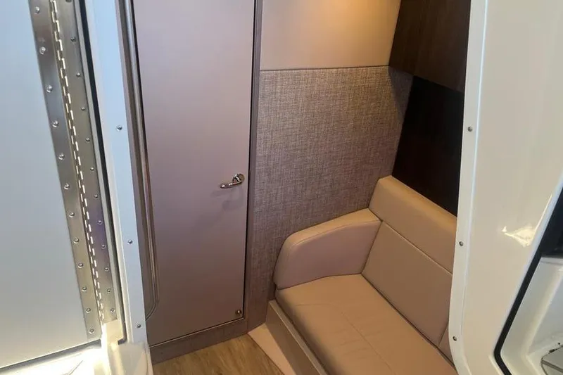 Slide: The Image of Interior of 2026 Formula 360 Crossover Bowrider I/O, featuring a cozy seating area. - 17