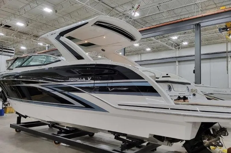 Slide: The Image of 2026 Formula 360 Crossover Bowrider I/O in a showroom, showcasing sleek design and modern features. - 20