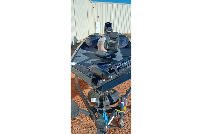 Slide: The Image of 2026 Ranger RT198P fishing boat on trailer, parked outdoors. - 10