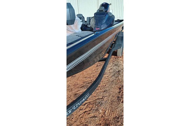 Slide: The Image of 2026 Ranger RT198P boat on trailer, side view, outdoors. - 13
