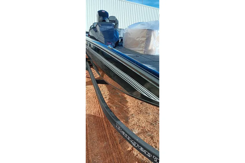Slide: The Image of 2026 Ranger RT198P boat on trailer, sleek design, parked outdoors. - 15