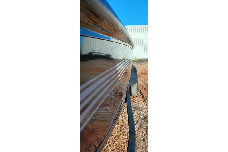 Slide: The Image of 2026 Ranger RT198P boat side view with sleek design and reflective surface. - 18