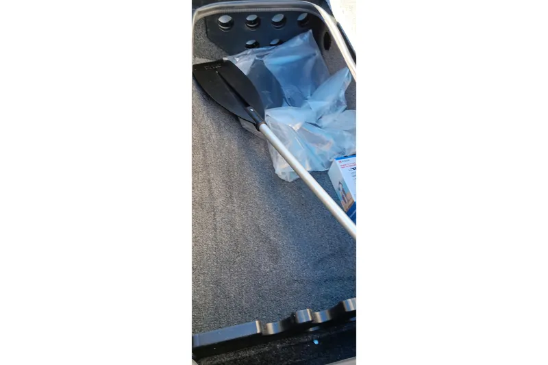 Slide: The Image of Interior of 2026 Ranger RT198P boat with paddle and packaging materials. - 19