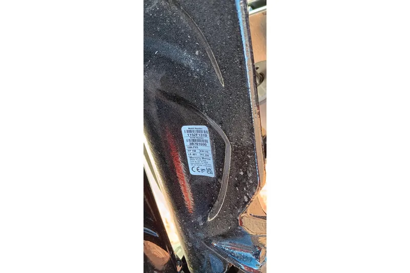 Slide: The Image of Close-up of a 2026 Ranger RT198P model label on a textured surface. - 22