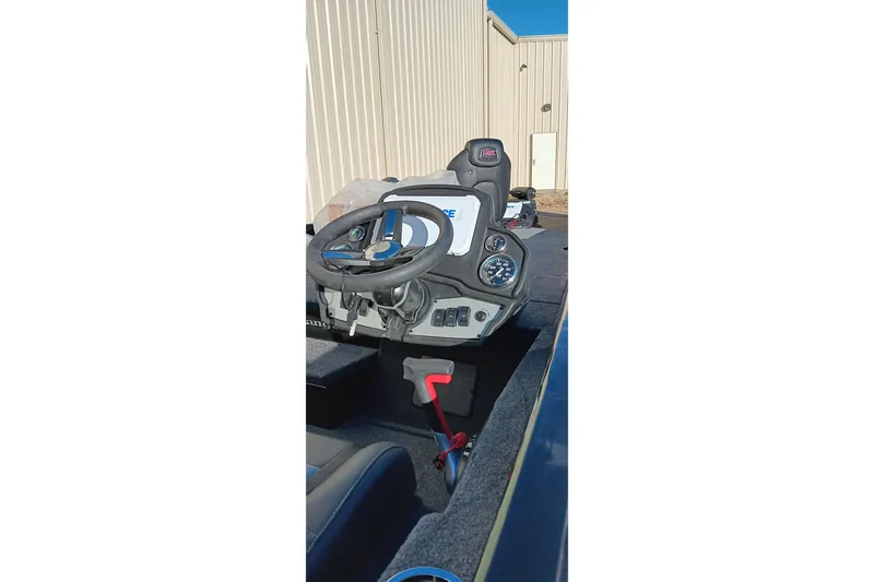 Slide: The Image of 2026 Ranger RT198P boat cockpit with steering wheel and control panel. - 8