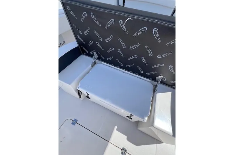 Slide: The Image of 2026 Robalo R300 Center Console boat seating with storage compartment open. - 14
