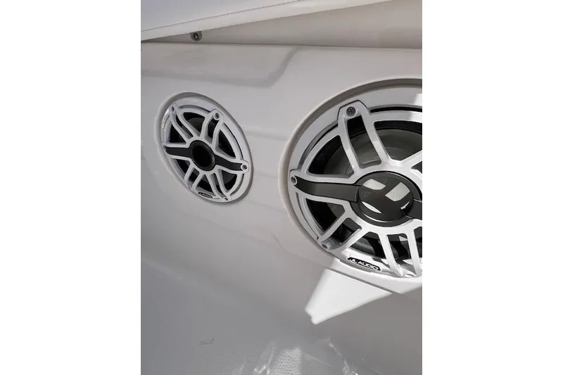 Slide: The Image of Speakers on 2026 Robalo R300 Center Console boat, featuring sleek white design. - 15