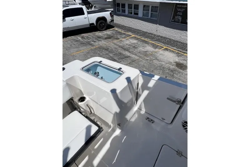 Slide: The Image of 2026 Robalo R300 Center Console boat interior with seating and storage compartments. - 18