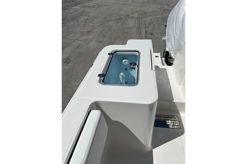 Slide: The Image of 2026 Robalo R300 Center Console boat with livewell on deck. - 19