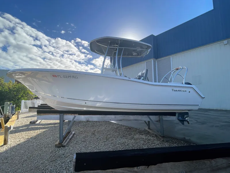 Slide: The Image of 2017 Tidewater 220 boat on a trailer under sunny skies. - 1