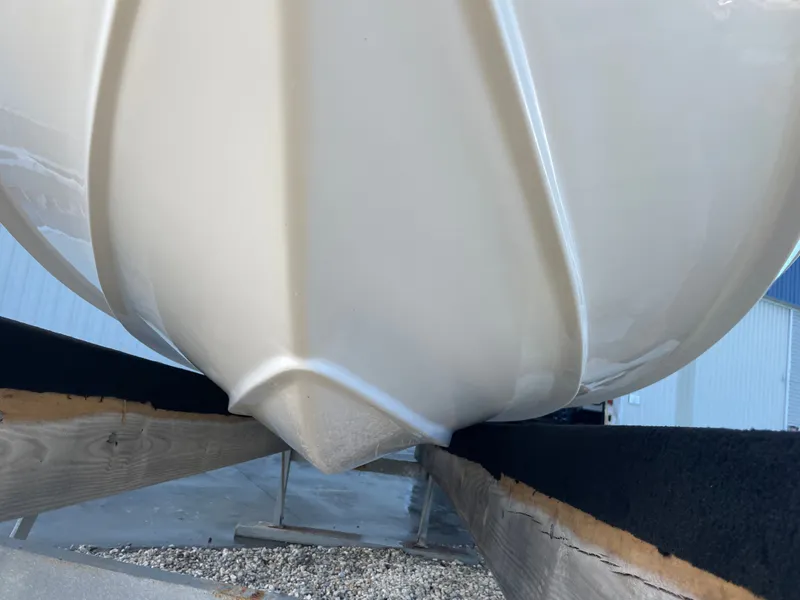 Slide: The Image of Close-up of the hull of a 2017 Tidewater 220 boat. - 12