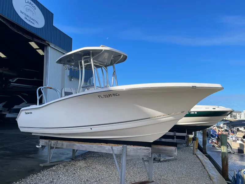 Slide: The Image of 2017 Tidewater 220 boat at marina, side view. - 13