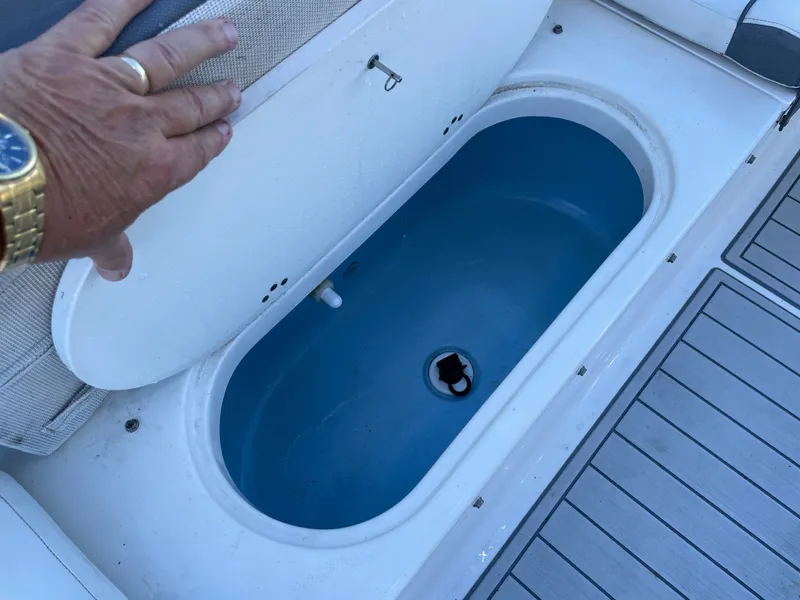 Slide: The Image of Tidewater 220 boat, 2017, with open storage compartment lid. - 19