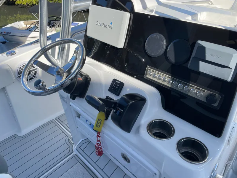 Slide: The Image of 2017 Tidewater 220 boat helm with Garmin system and controls. - 25